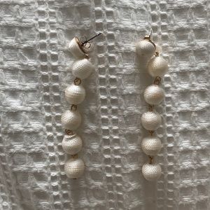 White dangle earrings